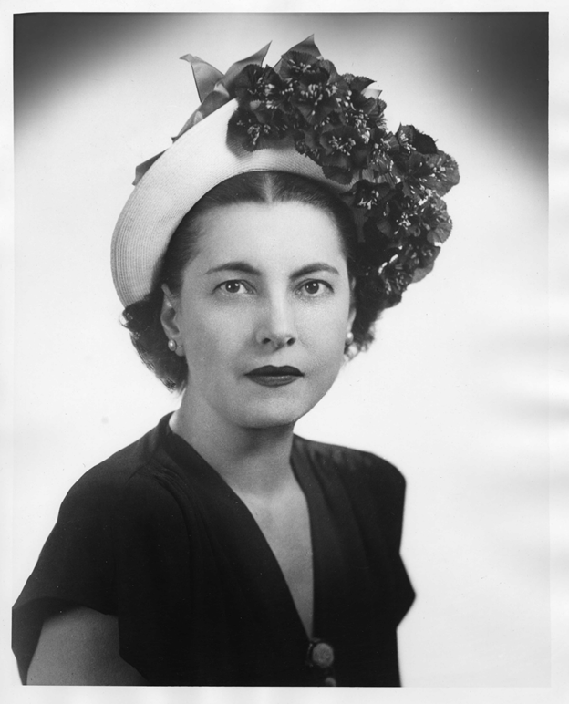 Studio portrait of Lilian Freehof wearing a flower hat