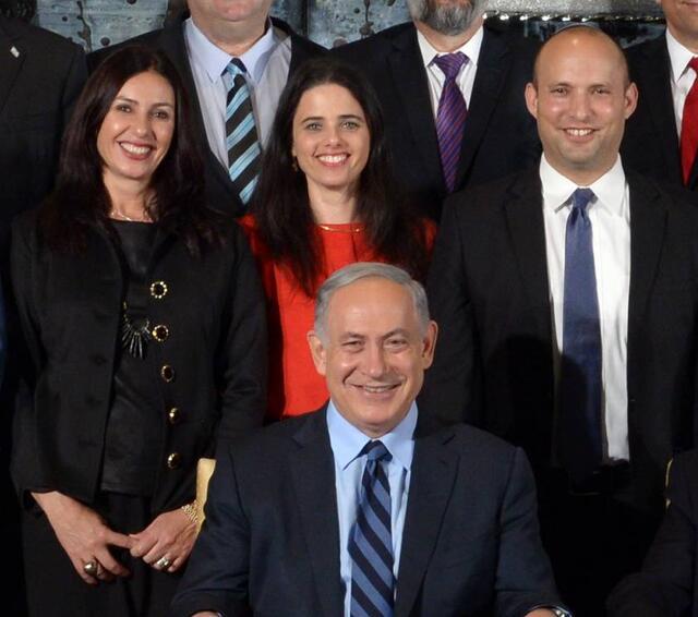 Miri Regev at center, standing behind and to the left of Israeli Prime Minister Benjamin Netanyahu and to the right of member of Knesset Ayelet Shaked and member of Knesset Naftali Bennet.
