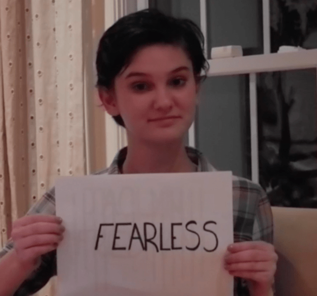 Caroline Kubzansky Holding "Fearless" Sign