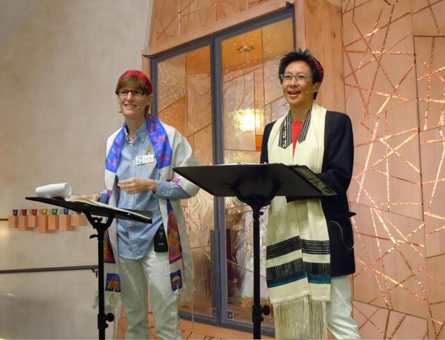 Two women on the bima at synagogue