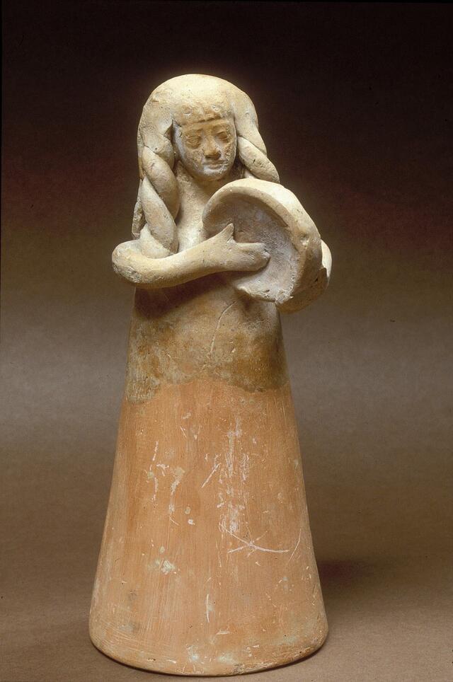 Figurine of woman playing drum