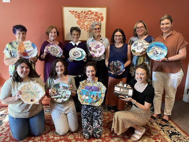 Group of women holding art plates