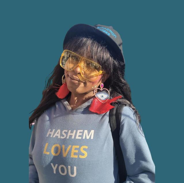 Elisheva Rishon wearing her brand’s “Hashem Loves You” hoodie 