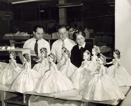 Beatrice Alexander Discussing Dolls from the Coronation Set with Colleagues, 1953