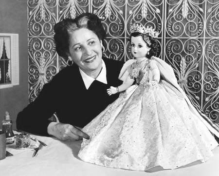 Beatrice Alexander Examining the Queen Elizabeth II Doll from the Coronation Set, 1953