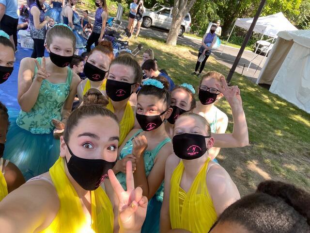 Groups of teens wearing masks and dance costumes