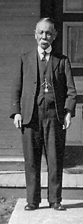 Black and white photo of a man in a suit