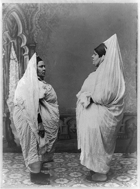 Two Jewish women standing, facing each other, in Tunisia